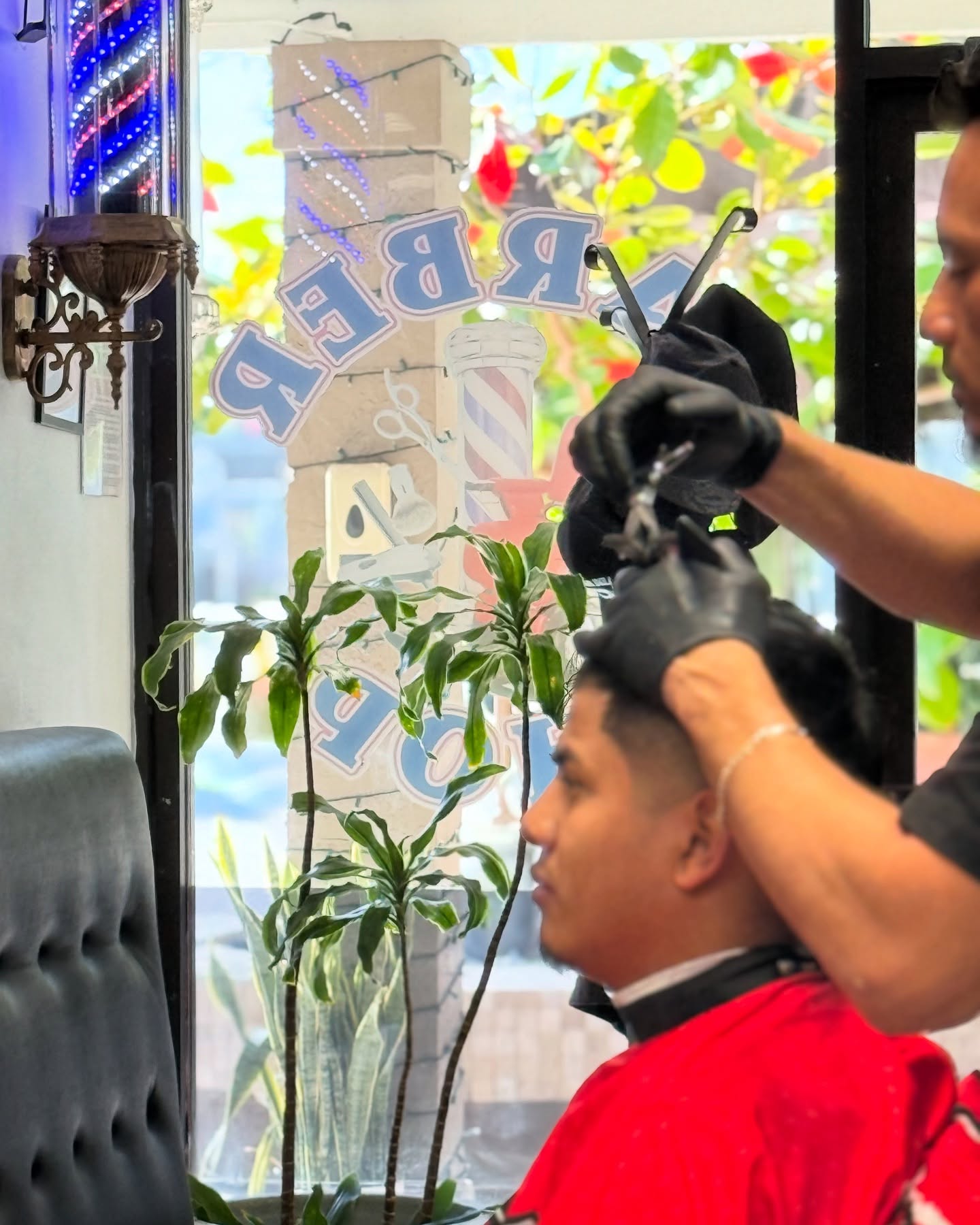 Barber pole in the shop window